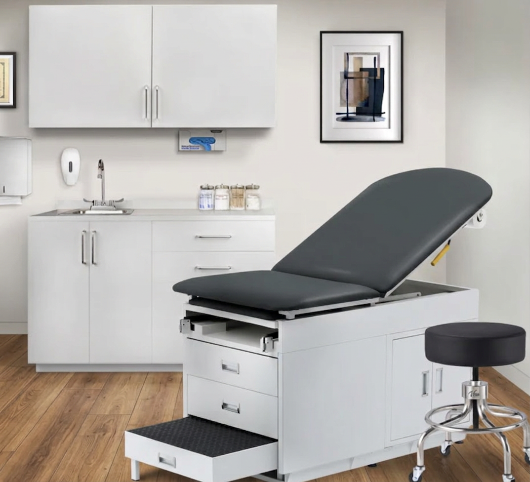Clinician taking a patient's blood pressure at a medical exam table